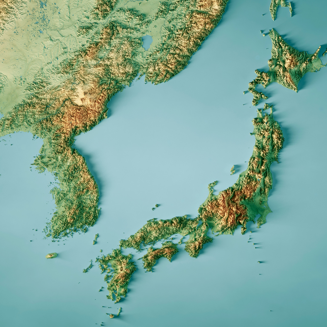Topographic relief map of Japan and the Korean Peninsula, showing mountains, valleys, coastlines, and surrounding seas in shades of green, brown, and blue.